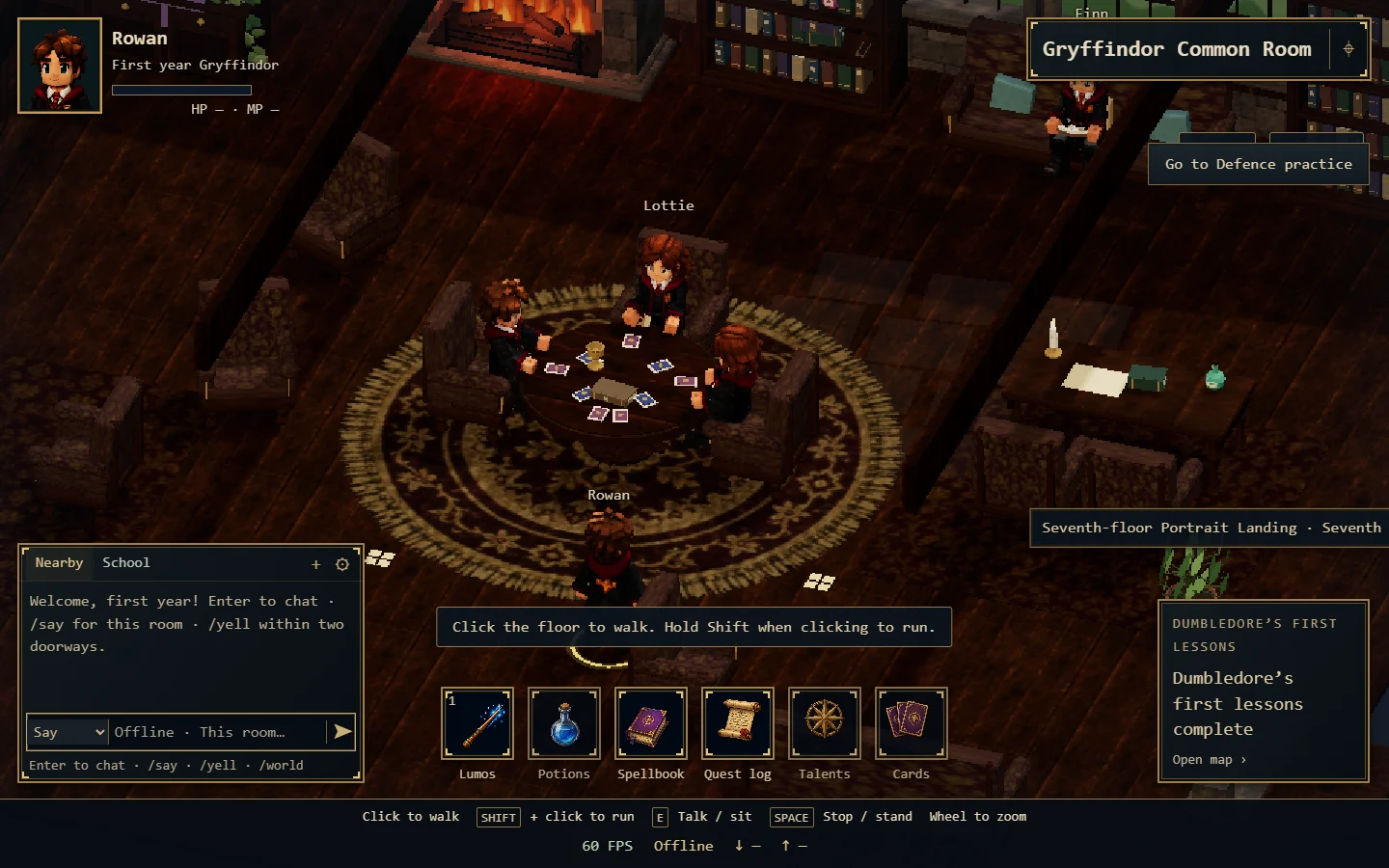 Students gathered around a table in the warm Gryffindor common room