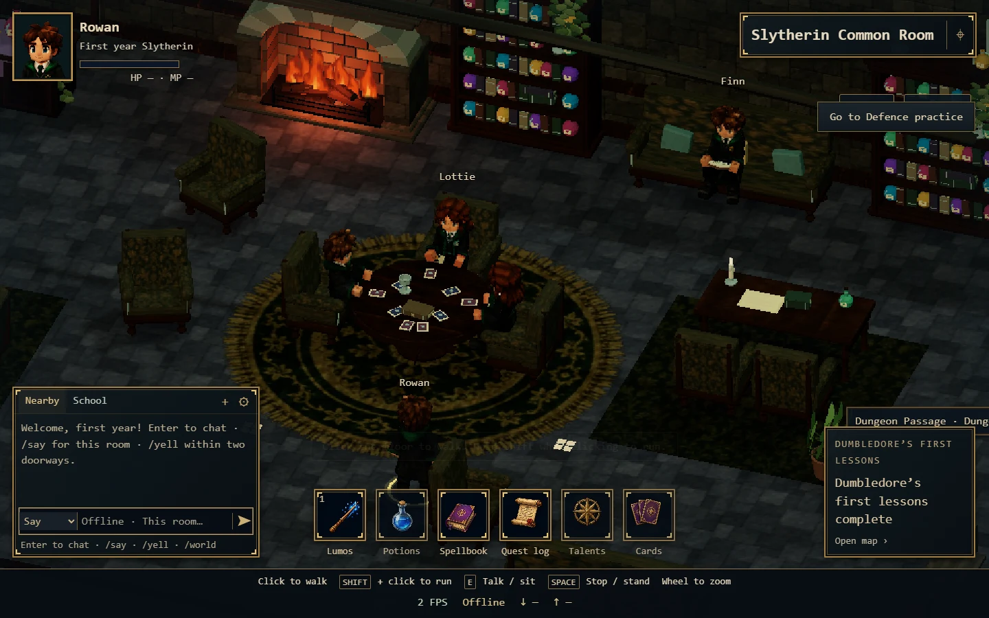 The Slytherin common room with green chairs, bookshelves and a glowing fireplace